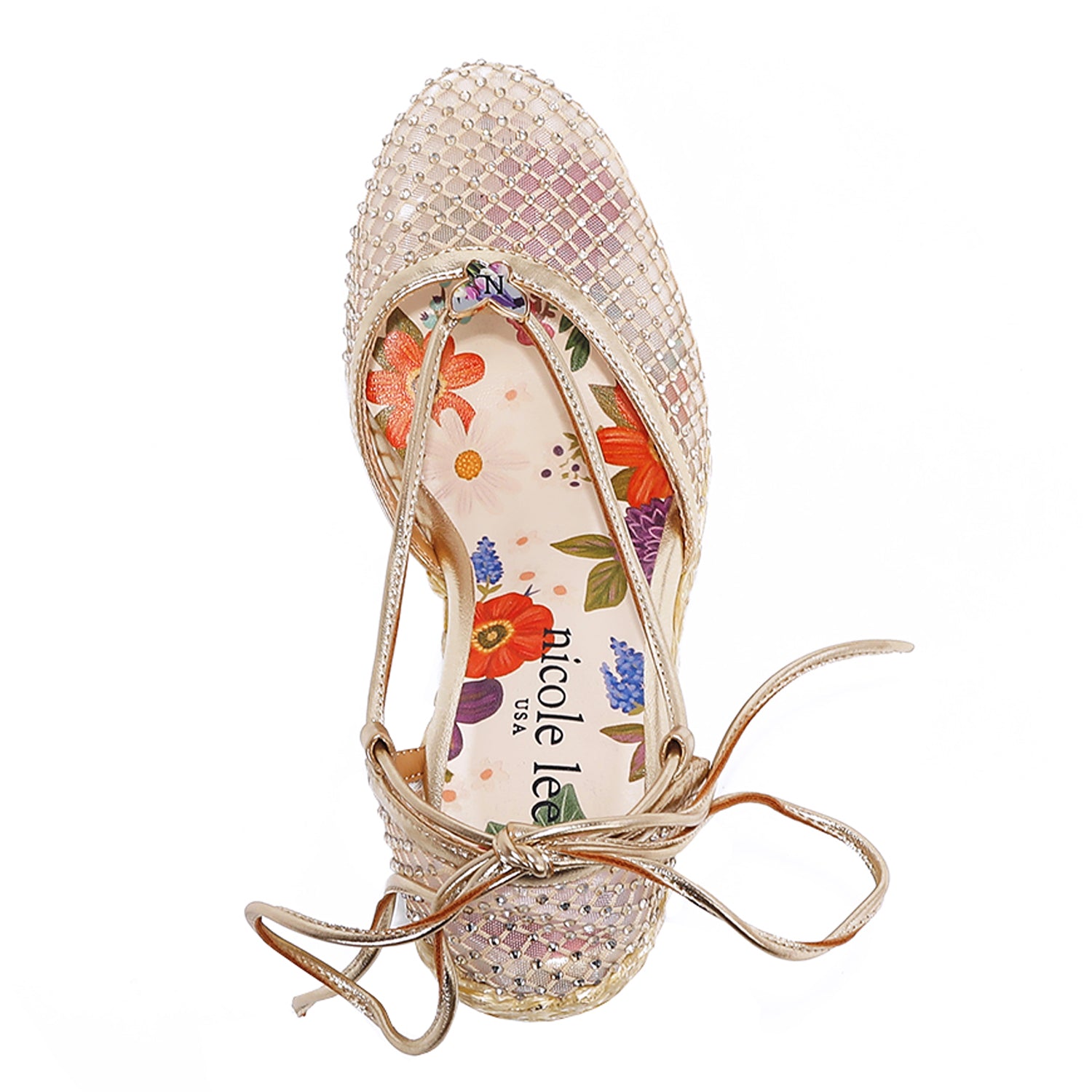 MAYA WRAP ESPADRILLE WEDGE SANDAL FROM A VIEW FROM ABOVE. FEATURES RHINESTONE MESH TOE CAP. TWO STRAPS THAT ARE TIED IN A BOW SHAPE.  THE INSOLE HAS A FLORAL PRINT.
