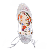 MAYA WRAP ESPADRILLE WEDGE SANDAL FROM A VIEW FROM ABOVE. FEATURES RHINESTONE MESH TOE CAP. TWO STRAPS THAT ARE TIED IN A BOW SHAPE.  THE INSOLE HAS A FLORAL PRINT.