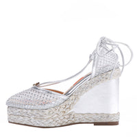MAYA WRAP ESPADRILLE WEDGE SANDAL IN COLOR SILVER. RHINESTONE MESH TOE CAP AND A BRAIDED TRIM PLATFORM. IT HAS TWO STRAPS WHERE YOU CAN TIE IT ON THE BACK OF THE ANKLE.