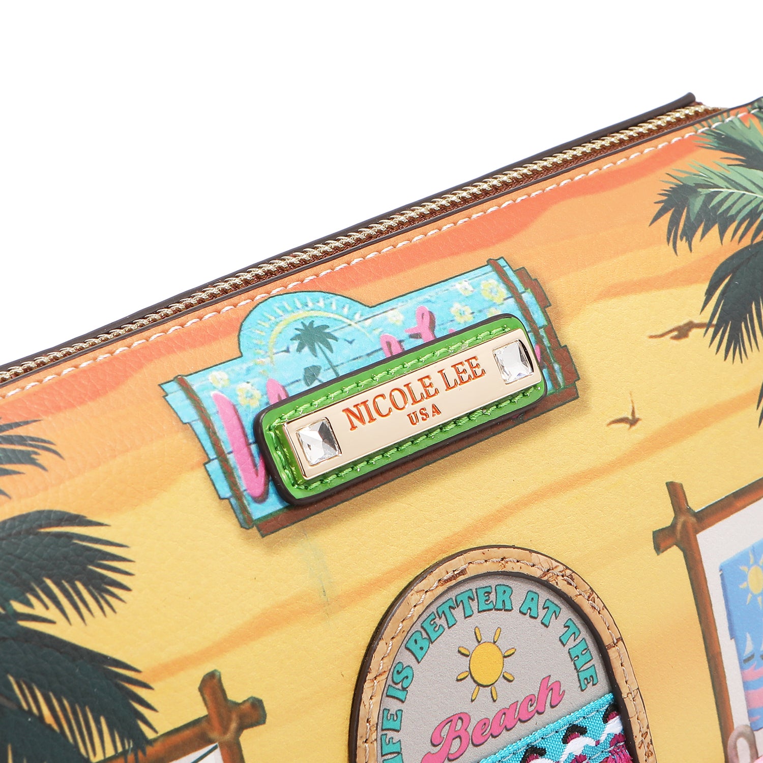 Close-up of our 'nicole lee' logo on the front of our Nicole Lee Sun and Sand Shoulder handbag. 